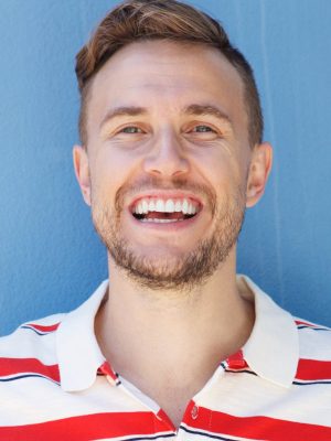 handsome-young-man-in-striped-shirt-laughing-again-QR3KWA9.jpg